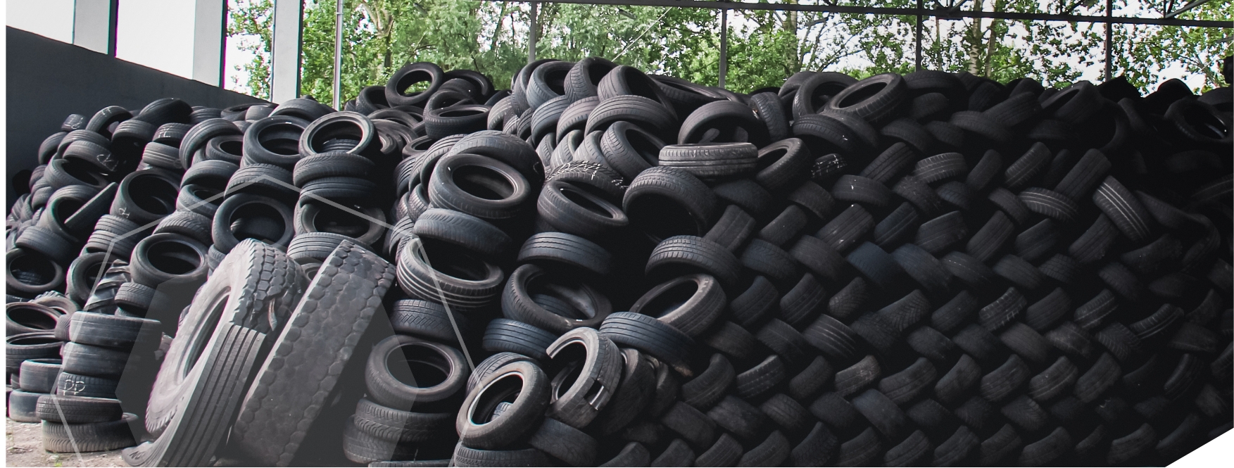 Old black tires in a large pile