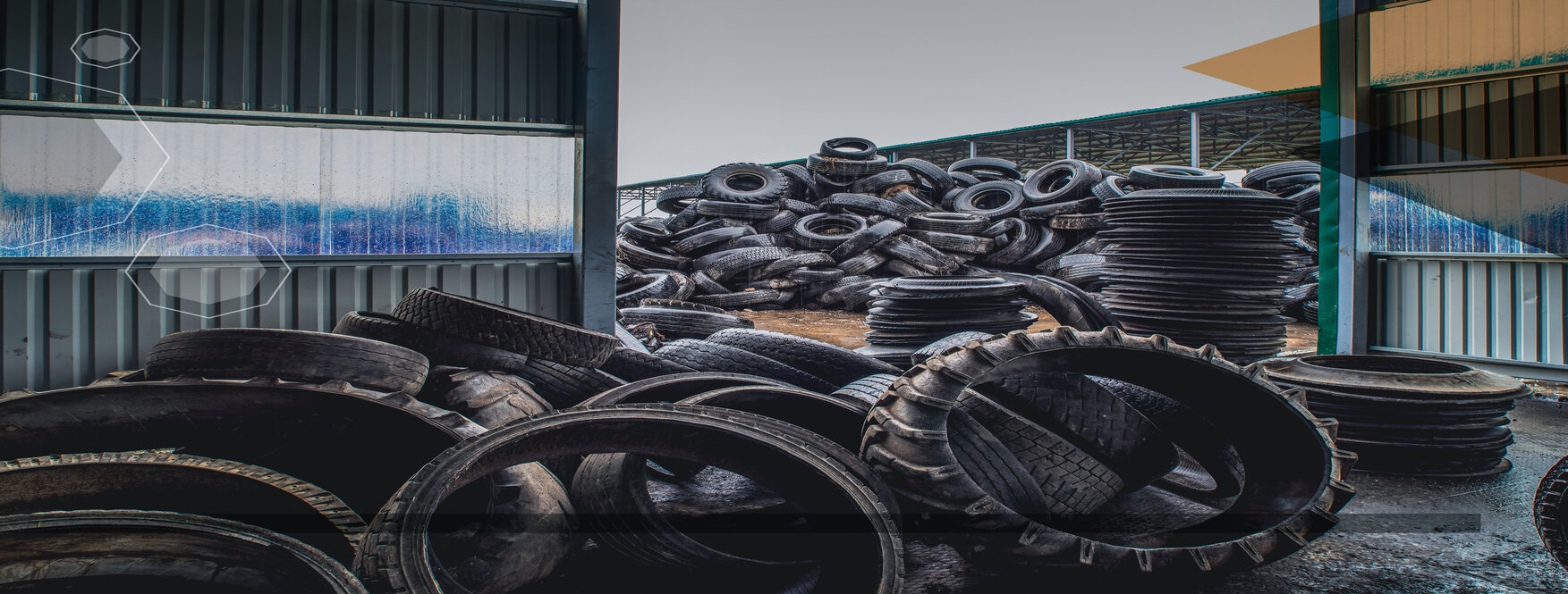 End of life black tires piled in a facility